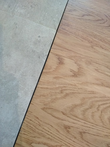 Стыковка плитки и ламината без порожка